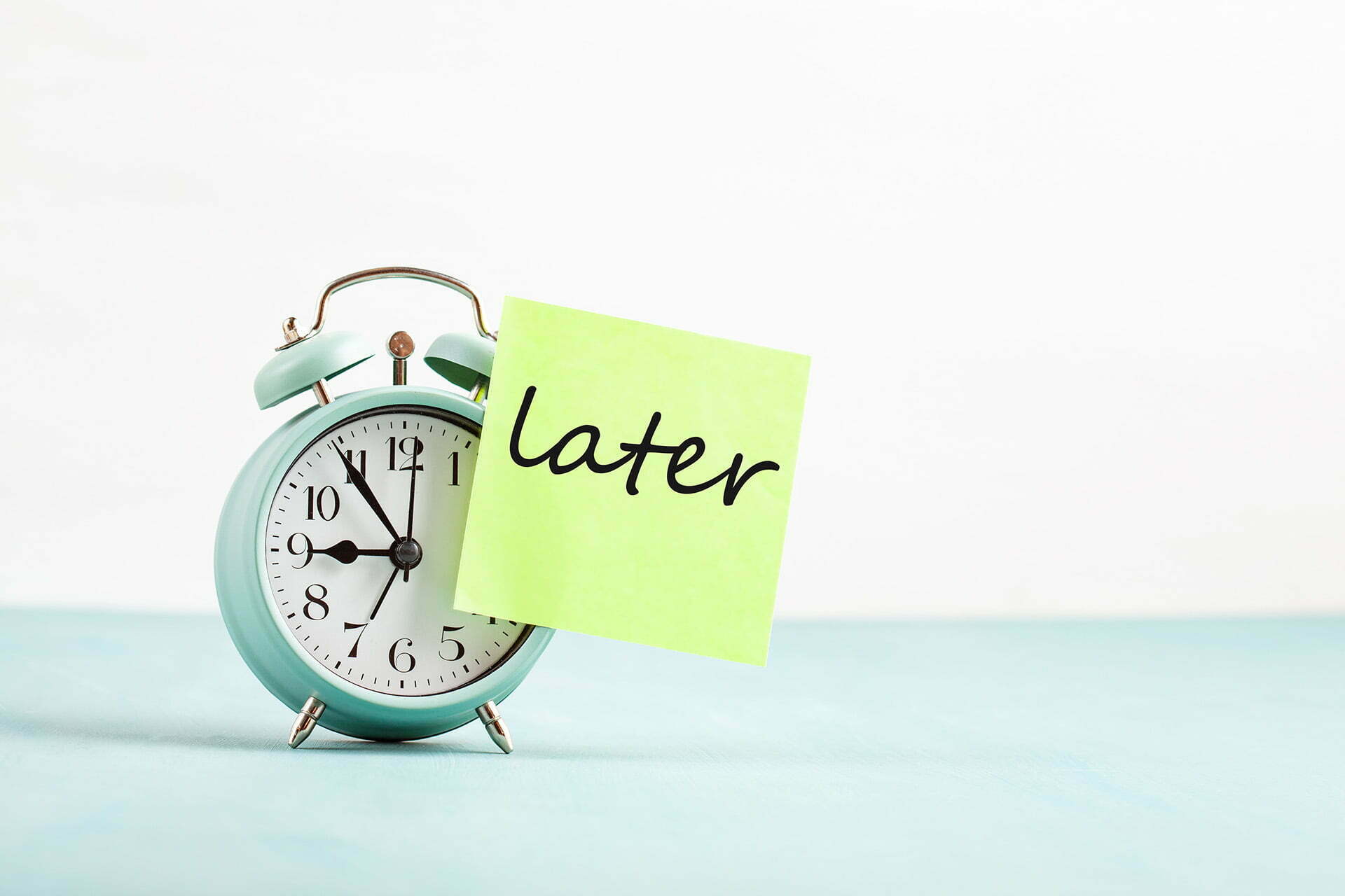 Stop procrastinating. Later post-it and clock.